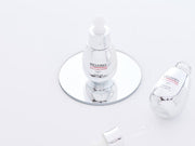 ProtoClinical k-beauty soft olive beauty product silhouette with a dark center on a light background.