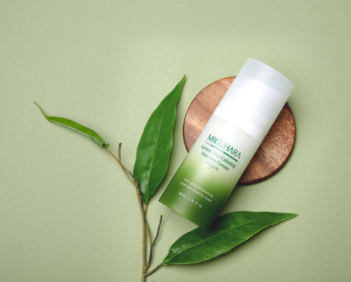 ProtoClinical k-beauty olive beauty product detail on a muted gray background.