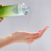 ProtoClinical k-beauty green beauty product detail with soft pink and beige tones on a light background.