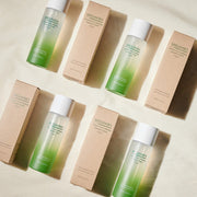 ProtoClinical k-beauty beige beauty product detail with soft olive vertical bands on a light background.