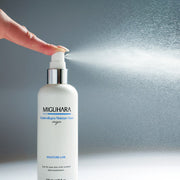 ProtoClinical k-beauty charcoal and pale blue beauty product detail on a light background.