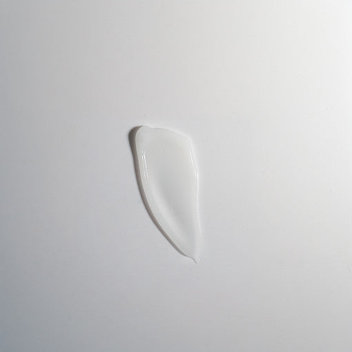 ProtoClinical k-beauty cool gray and pale blue beauty product detail on a light background.