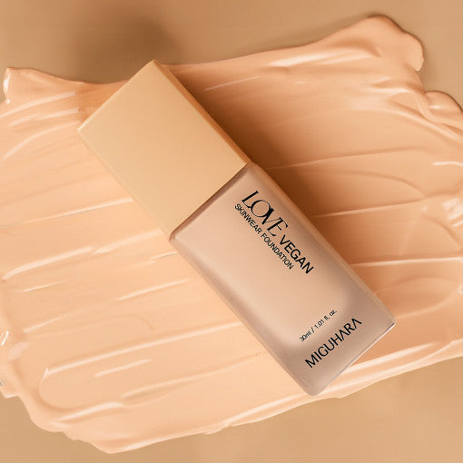 ProtoClinical k-beauty warm peach beauty product detail on a soft peach background.