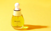 ProtoClinical k-beauty warm yellow beauty graphic with an olive horizontal center.