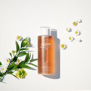 ProtoClinical k-beauty pale green and beige beauty product detail on a light background.