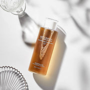 ProtoClinical k-beauty peach-toned beauty product detail on a pale blue background.