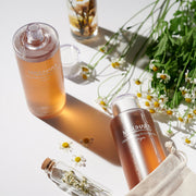 ProtoClinical k-beauty multitone beauty product graphic with a soft gold center on a light background.