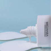 ProtoClinical k-beauty soft blue beauty graphic with a pale vertical center on a muted background.