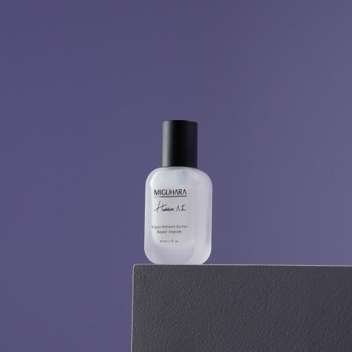 ProtoClinical k-beauty MIGUHARA Vegan Moisture Barrier Repair Ampoule 30ml dark lavender product silhouette with a soft pale vertical center on a muted background