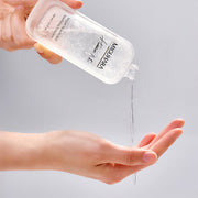 ProtoClinical k-beauty soft beige beauty product detail with horizontal gray and cream bands.
