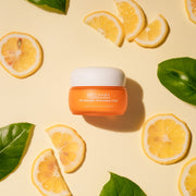 ProtoClinical k-beauty warm yellow beauty product detail with olive side accents on a light background.