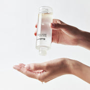 ProtoClinical k-beauty warm brown horizontal beauty packaging on a light background.
