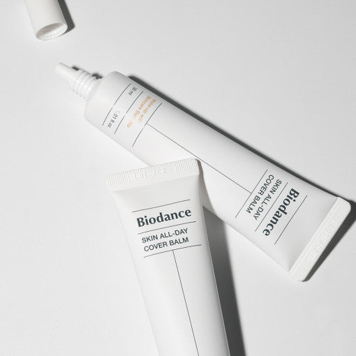 ProtoClinical k-beauty BIODANCE: Skin All-day Cover Balm (30ml) with pale cream packaging, a soft gray vertical center, and a light background