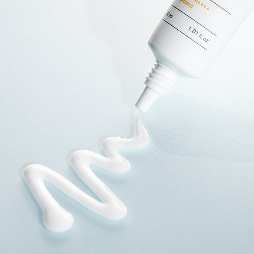 ProtoClinical k-beauty BIODANCE: Skin Barrier Sun Safe (30ml) with a soft gray vertical package on a pale blue background and light cream upper area