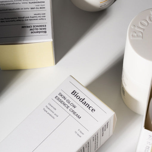 BIODANCE: Skin Glow Essence Cream (50ml) by ProtoClinical presented in a product detail layout on a light background, highlighting the cream packaging for a k-beauty skincare routine.