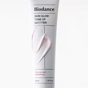 ProtoClinical k-beauty BIODANCE: Skin Glow Tone Up Booster Spf50+ Pa (30ml) with a single dark center package framed by pale side panels on a white background