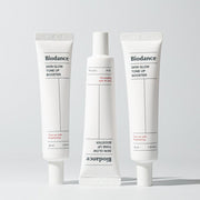 ProtoClinical k-beauty neutral beauty product packaging with a dark accent on a white background.