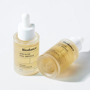 ProtoClinical k-beauty BIODANCE: Skin Glow Vital Ampoule (30ml) single amber ampoule bottle centered on a pale blue background