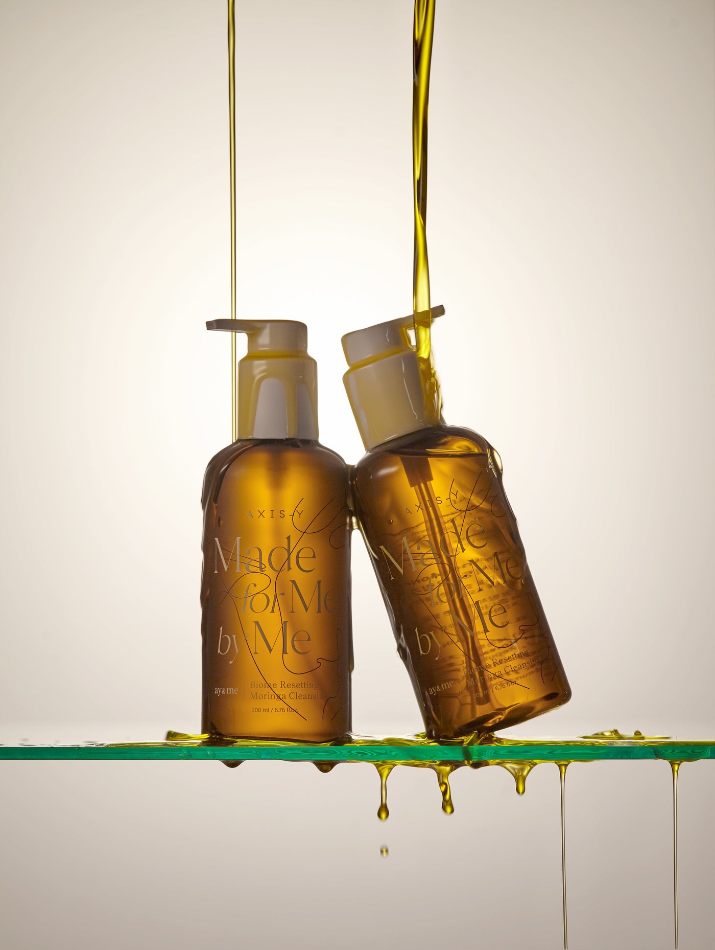 AXIS-Y Biome Resetting Moringa Cleansing Oil 200ml by ProtoClinical shown in product packaging for a k-beauty skincare routine.