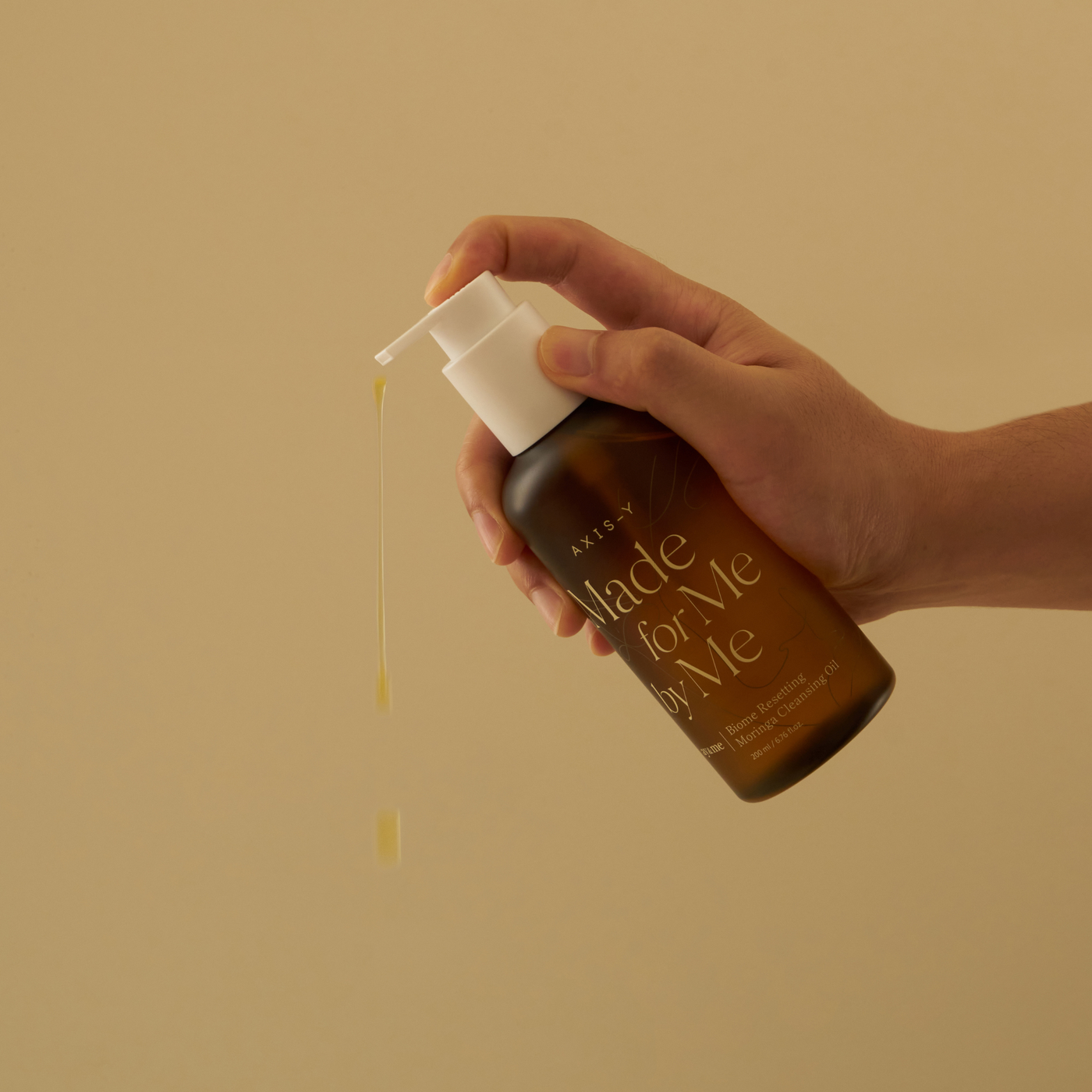 AXIS-Y Biome Resetting Moringa Cleansing Oil 200ml by ProtoClinical shown in product packaging for a k-beauty skincare routine.
