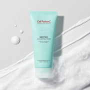 ProtoClinical k-beauty [Cell Fusion C] Melting Cleansing Foam 130ml single upright pale aqua cleansing foam container centered on a soft pink and aqua background.