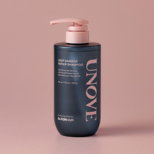 ProtoClinical k-beauty UNOVE DEEP DAMAGE REPAIR SHAMPOO 500ml single upright dark shampoo bottle centered on a soft pink background.