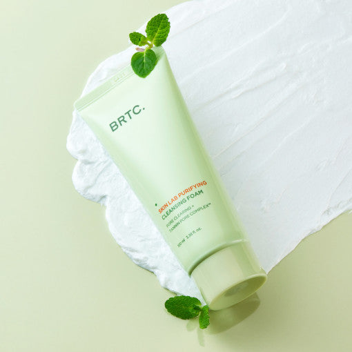 ProtoClinical k-beauty BRTC Skin Lab Purifying Cleansing Foam 100ml single upright pale green cleansing foam package centered on a light background with soft lavender side tones.