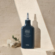 ProtoClinical k-beauty Solep Premier Hi-Gro Ampoule Treatment 150ml single dark gray ampoule bottle centered on a beige background.