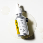 ProtoClinical k-beauty ilso CG Toning Serum 30ml in a dark gray bottle centered upright on a pale cream background with soft lavender side bands.