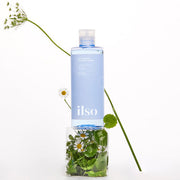 ProtoClinical k-beauty ilso Cicazulene Calming Toner 300ml in a tall pale aqua bottle centered upright on a white background with soft lavender side shading.