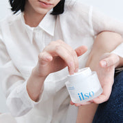 ProtoClinical k-beauty ilso Daily Moisture Pudding Cream 50ml in a rounded cream jar with a dark lid centered on a pale background with soft pink side shading