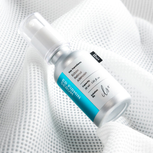 ProtoClinical k-beauty ilso ER Firming Serum (Retinol) 30ml single upright pale aqua serum bottle centered on a light background with warm peach side shading