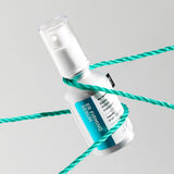 ProtoClinical k-beauty ilso ER Firming Serum (Retinol) 30ml single upright aqua serum bottle with a deeper blue center on a light background with soft peach side shading