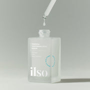 ProtoClinical k-beauty ilso Moringa Tightening Pore Serum 30ml close-up of a white dropper dispensing clear serum above the frosted bottle opening on a soft gray background