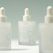 ProtoClinical k-beauty ilso Moringa Tightening Pore Serum 30ml single upright slim serum bottle centered on a light background with muted sage top shading and soft mauve side shading.