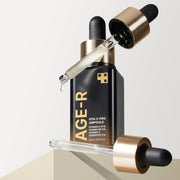 ProtoClinical k-beauty charcoal gray beauty product silhouette with pale lavender side accents and a muted beige lower accent on a light background.