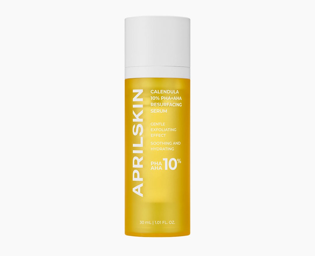 ProtoClinical k-beauty APRILSKIN Calendula PHA + AHA Resurfacing Serum 30ml single upright pale yellow serum bottle centered on a pale blue and cream background