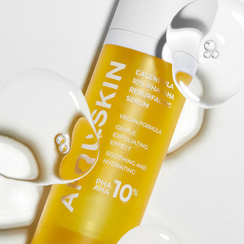 ProtoClinical k-beauty APRILSKIN Calendula PHA + AHA Resurfacing Serum 30ml single upright pale yellow serum bottle centered on a pale blue and cream background