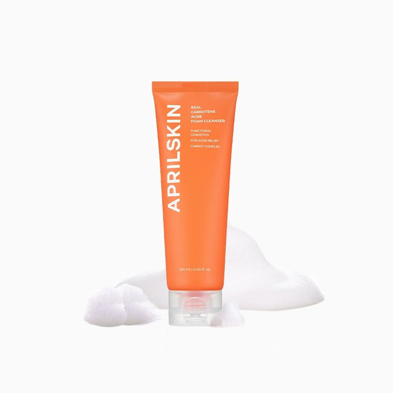 APRILSKIN Carrotene Acne Foam Cleanser 120ml by ProtoClinical shown in a clean foam cleanser packshot on a light background, highlighting the tube packaging for a k-beauty skincare routine.