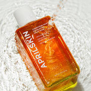 APRILSKIN Carrotene IPMP Exfoliating Body Wash 300ml by ProtoClinical shown in a front-facing body wash packshot on a simple background, highlighting the bottle label for a k-beauty body care routine.