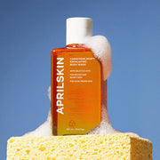 APRILSKIN Carrotene IPMP Exfoliating Body Wash 300ml by ProtoClinical displayed in a neat skincare layout featuring the exfoliating body wash bottle for a k-beauty body care routine.
