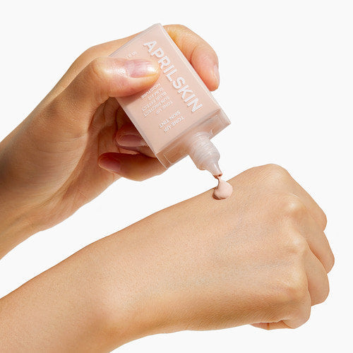 APRILSKIN Tone Up Skin Tint 30g (SPF 50+) by ProtoClinical shown in a neat product composition highlighting the tone-up skin tint tube for a k-beauty routine.