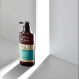 ProtoClinical k-beauty dark gray vertical beauty product silhouette on a light background with soft side highlights.