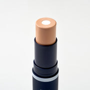 ProtoClinical k-beauty slim beige and gray beauty product silhouette centered on an off-white background.