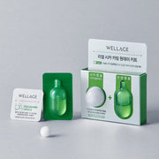 ProtoClinical k-beauty sage green skincare product on a pastel pink and aqua background.