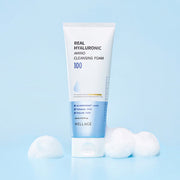 ProtoClinical k-beauty WELLAGE Real Hyaluronic Amino Cleansing Foam 150ml single upright cleansing foam tube in pale blue packaging on a light background.