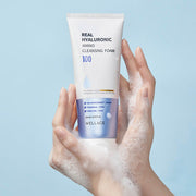 ProtoClinical k-beauty WELLAGE Real Hyaluronic Amino Cleansing Foam 150ml single upright cleansing foam tube in pale blue packaging on a light background.
