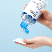 ProtoClinical k-beauty cool gray beauty product detail on a pale blue background.