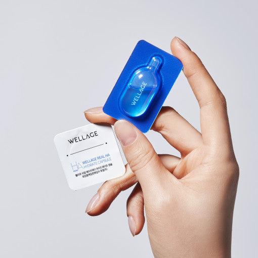 ProtoClinical k-beauty blue and mauve product packaging on a light neutral background.