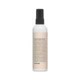 ProtoClinical k-beauty taupe vertical beauty product silhouette with pale peach side accents on a light background.